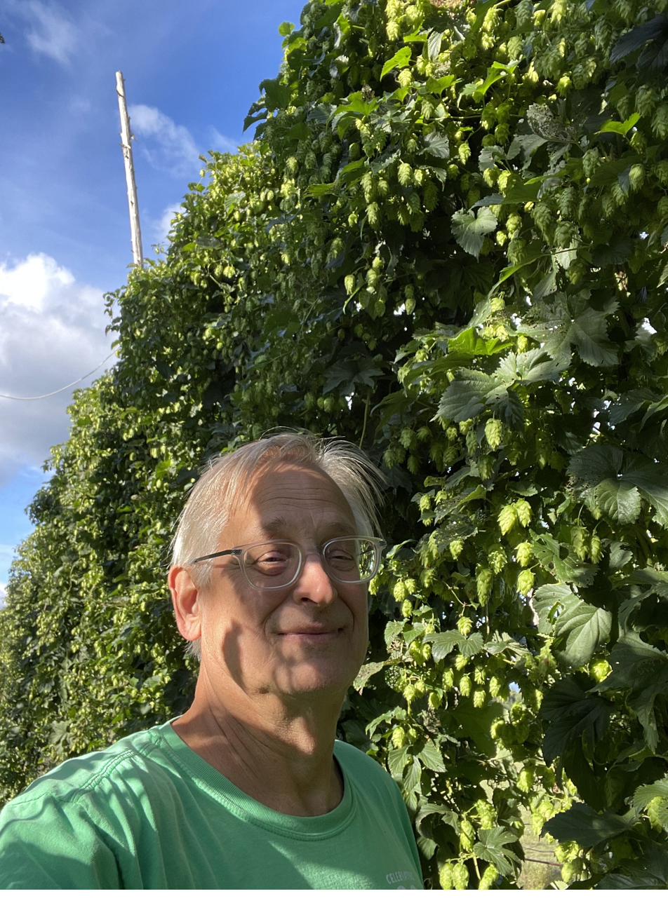 Mike Murto in the hopyard at Balancing Act Hops